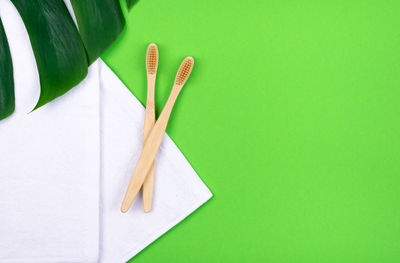 High angle view of white paper on green table