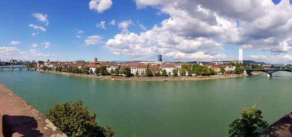 Panoramic view of river and buildings against sky