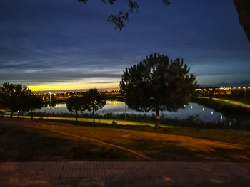 Scenic view of landscape against sky at sunset