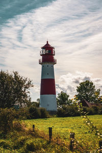 Lighthouse on the baltic sea with an overcast sky.