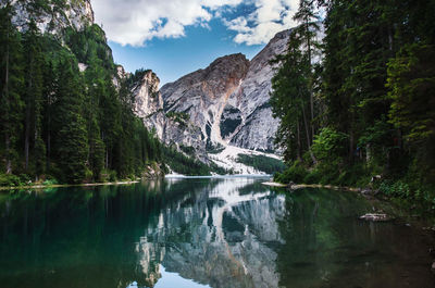 Scenic view of lake and mountains against sky