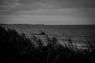 Scenic view of calm sea against sky