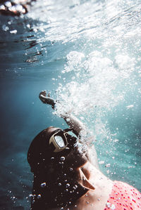 Close-up of man swimming in sea