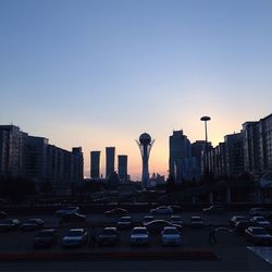 Traffic on city street at dusk