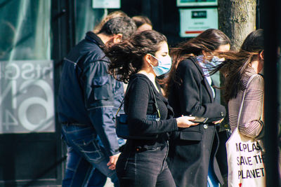 Group of people standing at home