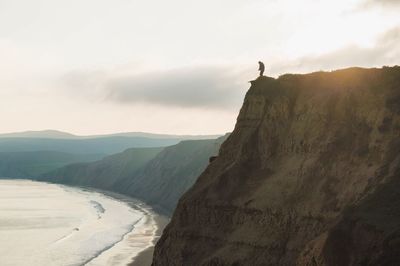 Man standing on sand dune