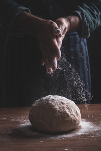 Close-up of man preparing food