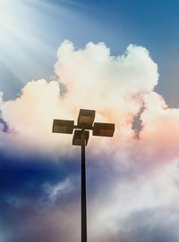 Low angle view of floodlight against sky