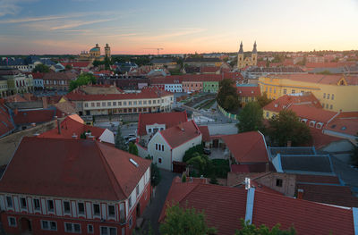 Aerial view of town against sky during sunset