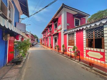 Road amidst buildings in city