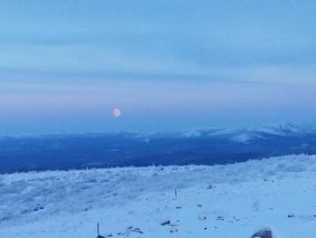 Scenic view of snow covered mountain against sky
