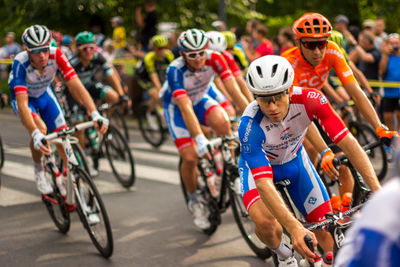 People riding bicycle on street