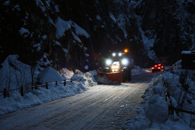 Snow covered street at night