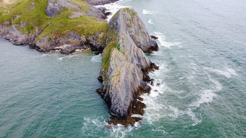 High angle view of rocks on sea