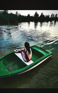 Woman swimming in lake