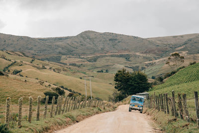 Road amidst landscape against sky