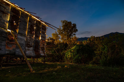 Low angle view of old building against sky at night