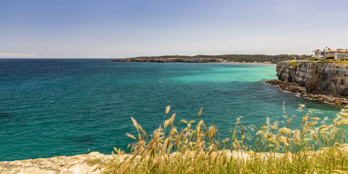 Scenic view of sea against clear sky