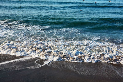 Aerial view of surf on beach