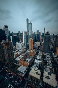 High angle view of modern buildings in city against sky