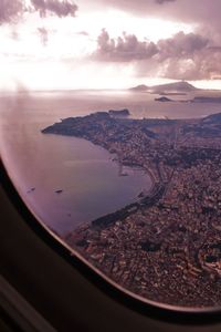 Aerial view of sea seen through airplane window