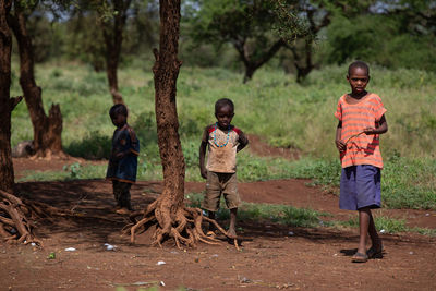 Full length of children standing on land