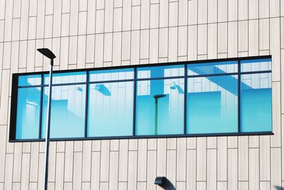 Low angle view of building against blue sky