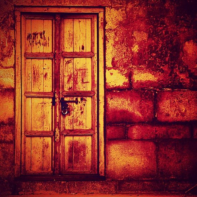 door, building exterior, closed, built structure, architecture, window, house, red, safety, wood - material, protection, entrance, security, old, wall - building feature, outdoors, day, no people, wall, brick wall