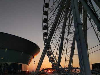 Low angle view of ferris wheel against sky