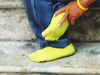 Low section of woman standing on tiled floor