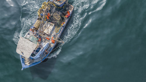 High angle view of boat floating on sea