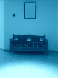 Close-up of open book against blue wall