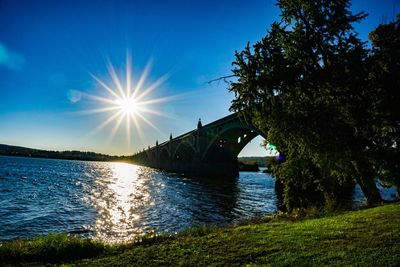 Sun shining over calm lake