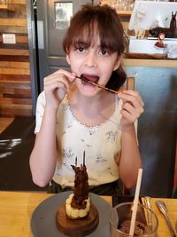 Mid adult woman looking away at restaurant