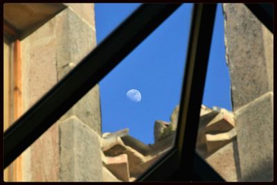 Low angle view of built structure against blue sky