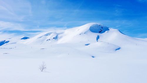 Scenic view of snow covered mountains