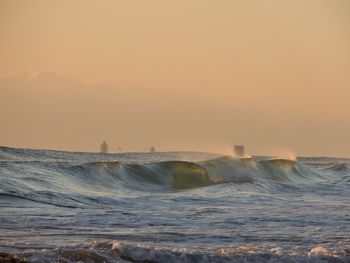 Scenic view of sea against sky during sunset