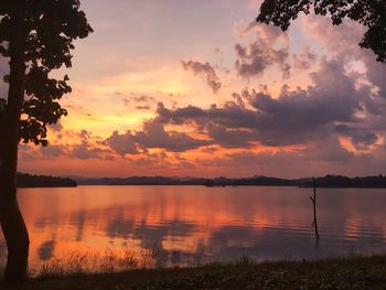 Scenic view of lake against orange sky