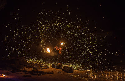 View of firework display at night