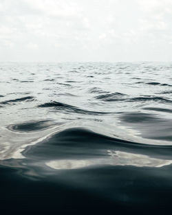 Swimming pool in sea against sky