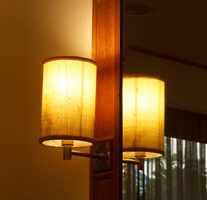 Close-up of illuminated lamp at home