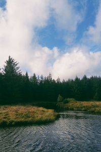 Scenic view of landscape against cloudy sky