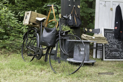 Bicycle parked on grassy field at park