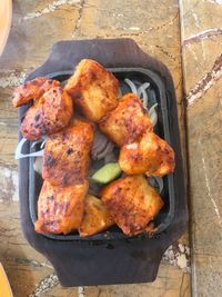 High angle view of meat on barbecue grill