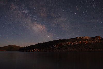 Scenic view of lake against star field