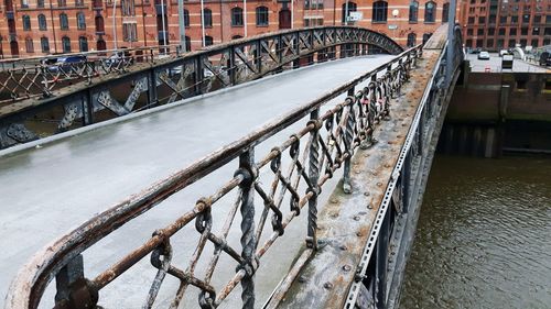 Snow covered bridge in city