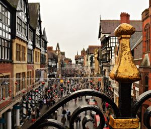 Panoramic view of crowd on street against buildings
