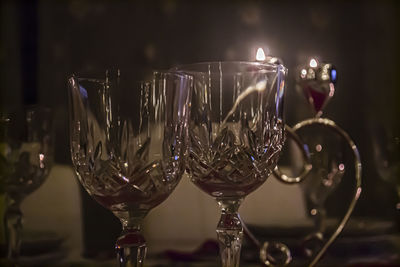 Close-up of wine glasses on table