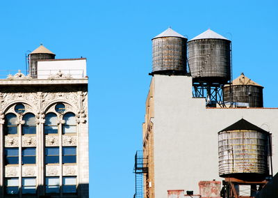 Low angle view of building against clear blue sky