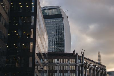 Low angle view of building against cloudy sky